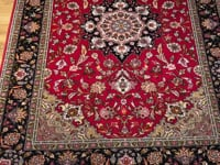 Tabriz Fine Wool & Silk Hand Knotted Persian Rug, featuring Red tones and Floral design, ideal area rug for any room in your home.